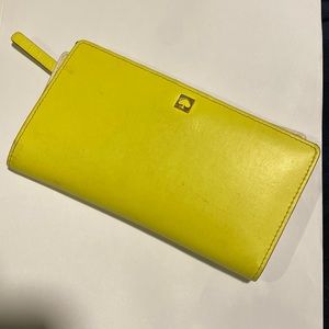 Yellow and tan Kate spade wallet.